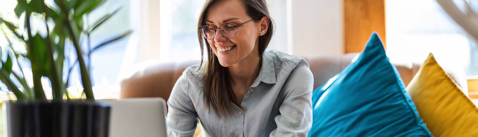 Woman using laptop in living room