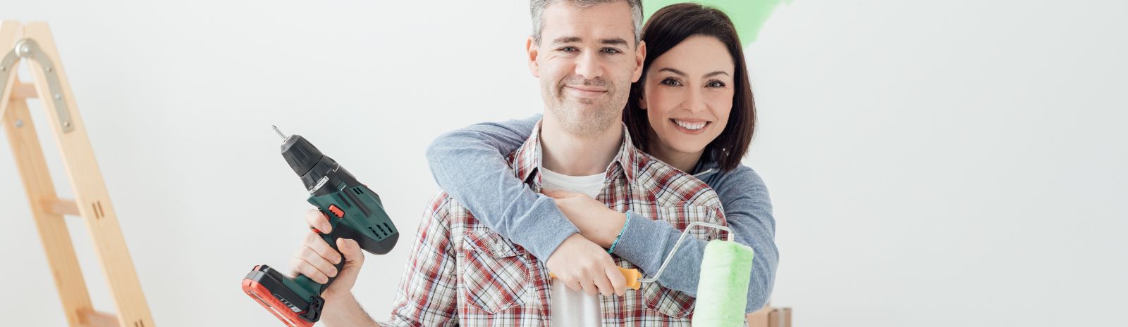A happy couple doing home improvement
