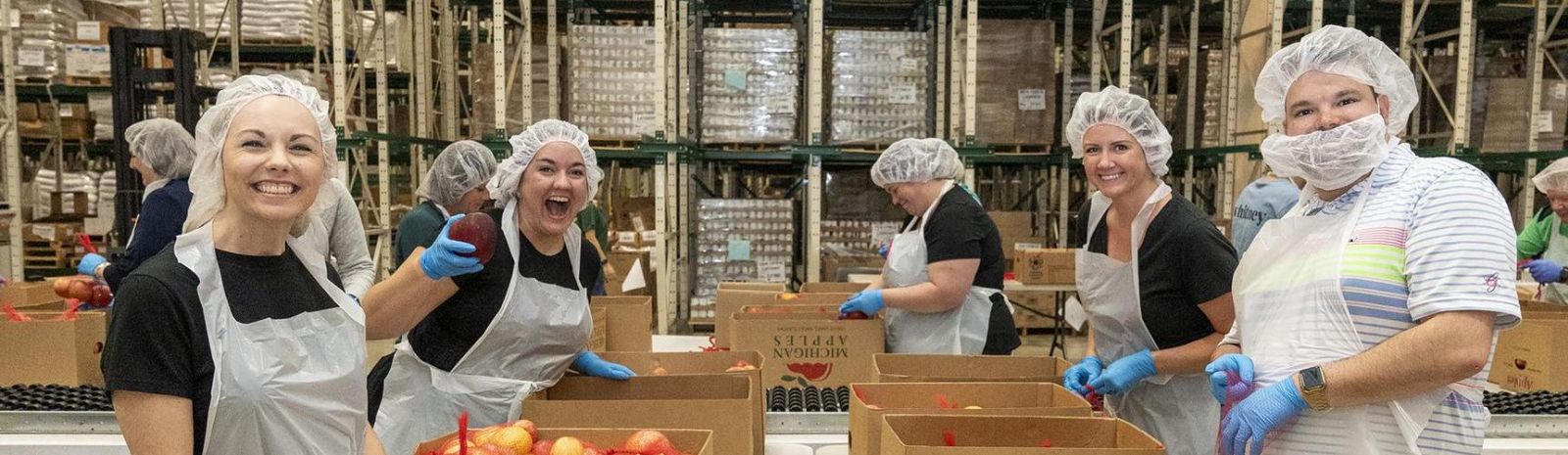 People volunteering at a food bank
